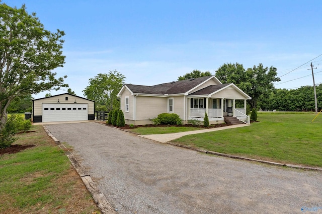 265 Dorning Rd, Harvest, AL 35749 - single story home featuring a porch, an outbuilding, a garage, a front yard, and a shingled roof