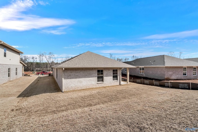 rear view of house with a yard