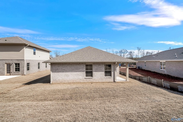 rear view of house with a lawn