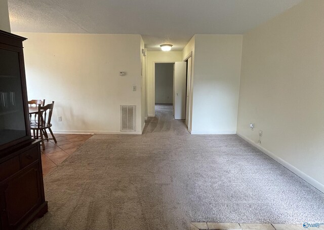 dining room with tile patterned flooring and a textured ceiling