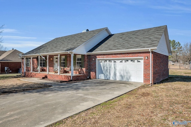 view of front facade with a garage and covered porch