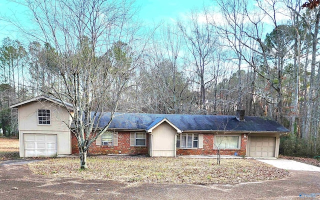 single story home with a garage