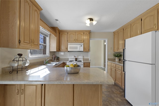 kitchen with light brown cabinets, sink, kitchen peninsula, and white appliances
