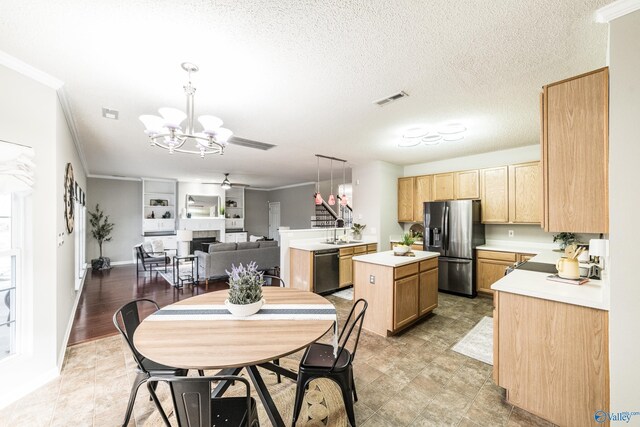 kitchen with dishwashing machine, a sink, visible vents, stainless steel refrigerator with ice dispenser, and a tiled fireplace