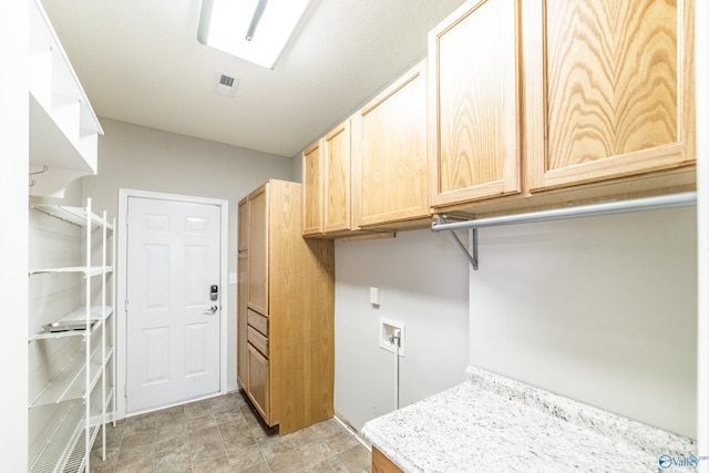 laundry room featuring visible vents, washer hookup, and cabinet space