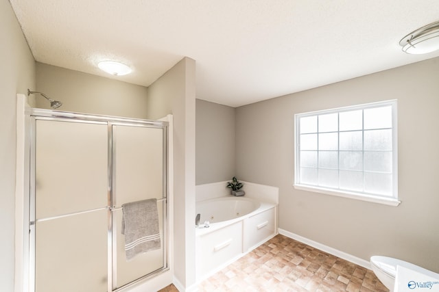 full bath featuring a textured ceiling, toilet, baseboards, a whirlpool tub, and a stall shower