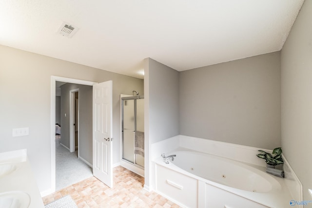 bathroom with a stall shower, a tub with jets, visible vents, and a sink