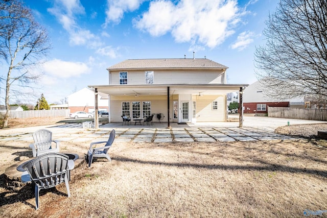 back of property featuring a ceiling fan, french doors, fence, and a patio