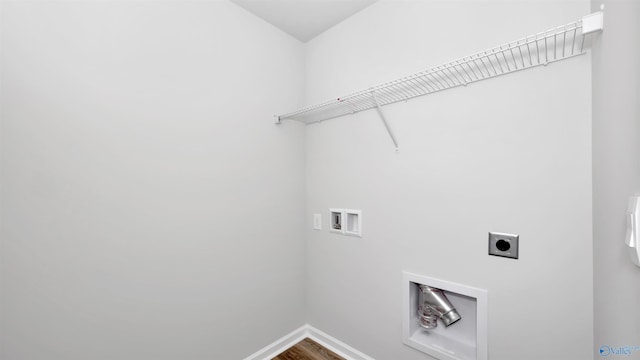 laundry area with hookup for a washing machine, hardwood / wood-style floors, and hookup for an electric dryer