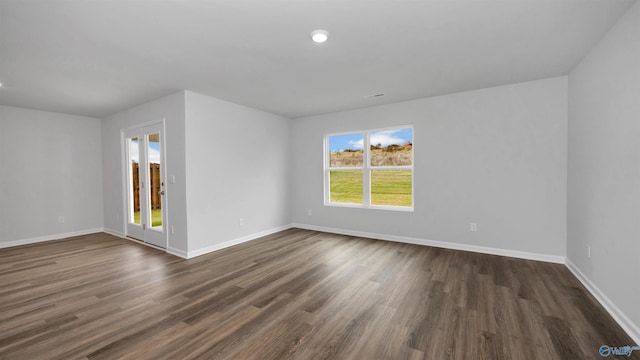 unfurnished room featuring dark hardwood / wood-style floors