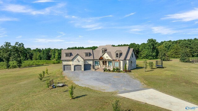 french provincial home with a garage