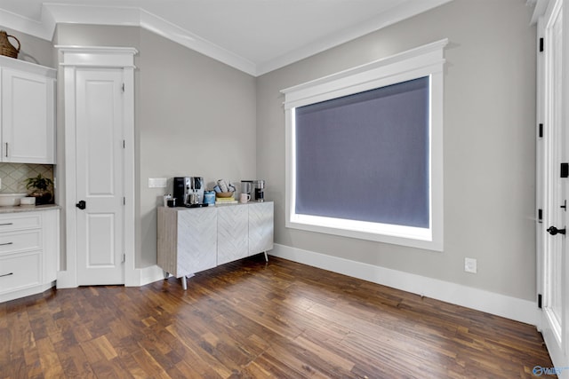 bedroom featuring dark hardwood / wood-style flooring and crown molding