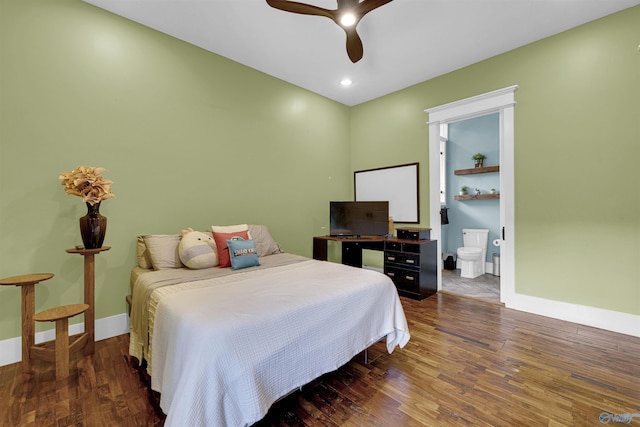 bedroom featuring ceiling fan, ensuite bath, and dark hardwood / wood-style floors