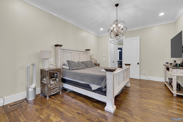 bedroom featuring dark hardwood / wood-style flooring, ornamental molding, and a chandelier