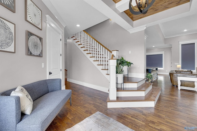 entryway featuring dark hardwood / wood-style flooring and ornamental molding