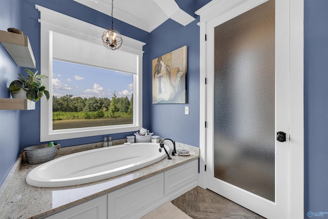 bathroom featuring a notable chandelier and a bathing tub