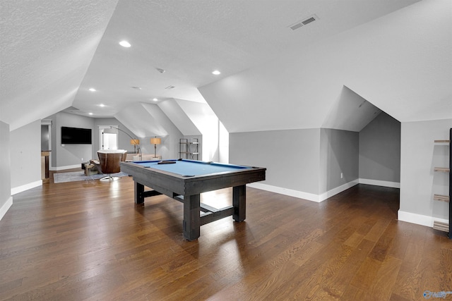 game room with lofted ceiling, dark wood-type flooring, pool table, and a textured ceiling