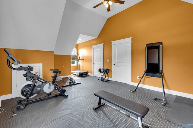 workout area featuring ceiling fan, vaulted ceiling, and carpet floors