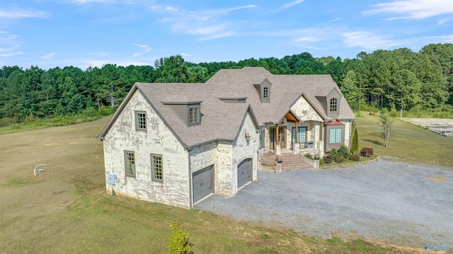 view of front facade with a front yard and a garage