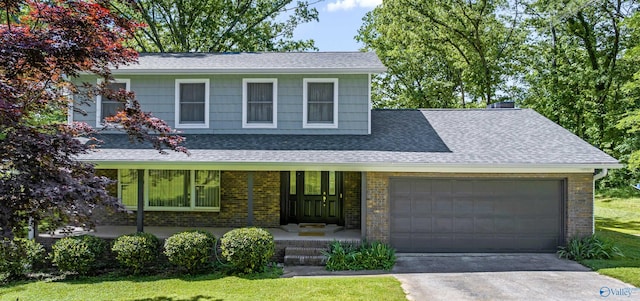 view of front of house with a garage and covered porch