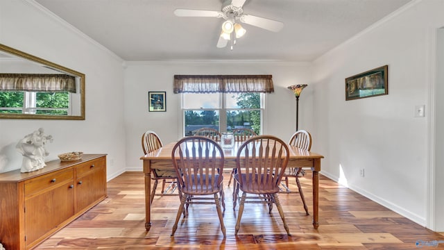 dining space featuring crown molding, ceiling fan, a healthy amount of sunlight, and light hardwood / wood-style floors