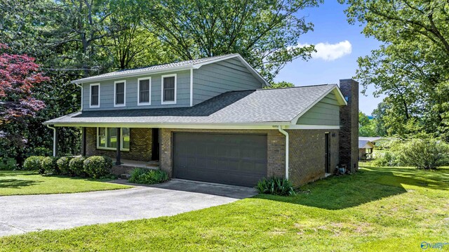 front of property featuring a garage and a front lawn