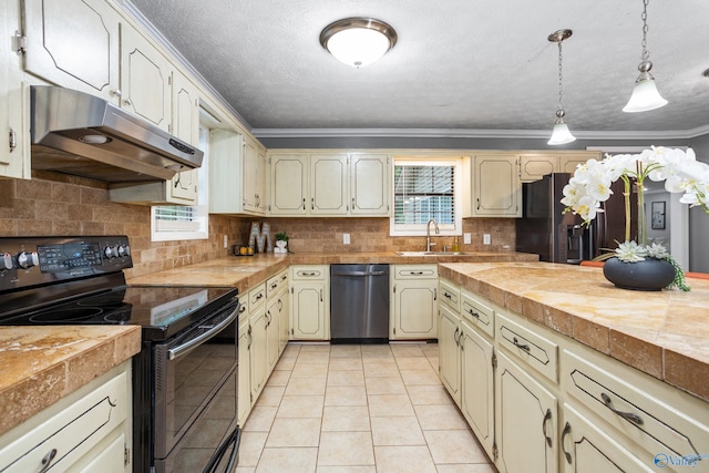 kitchen with a sink, under cabinet range hood, decorative backsplash, crown molding, and appliances with stainless steel finishes