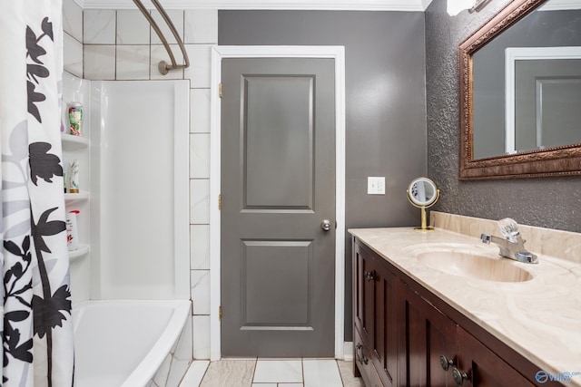 full bathroom featuring shower / bath combo with shower curtain and vanity