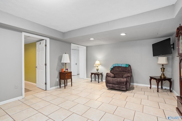 sitting room with recessed lighting, light tile patterned flooring, and baseboards