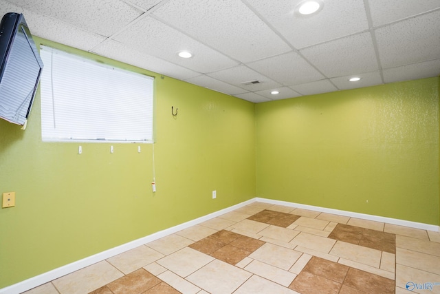 unfurnished room featuring light tile patterned flooring, visible vents, a paneled ceiling, and recessed lighting