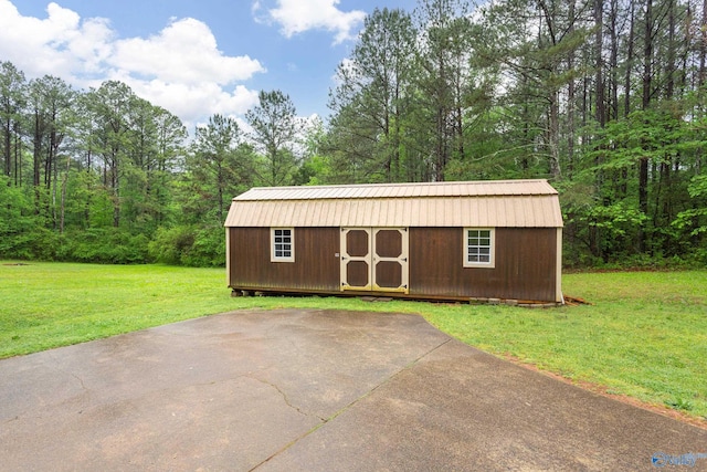 view of shed with a forest view