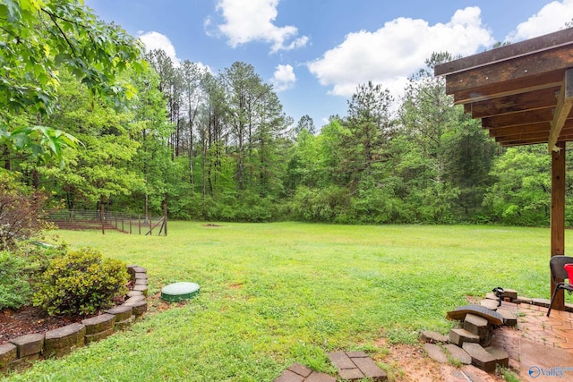view of yard with a forest view