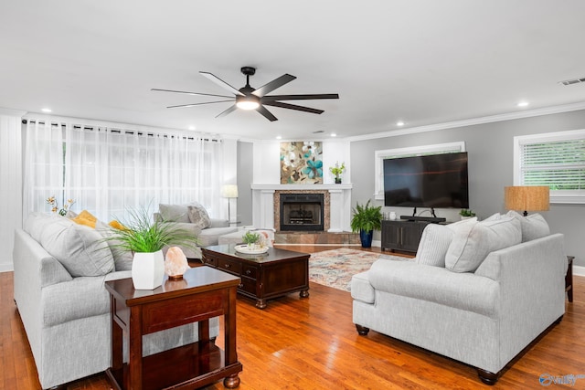 living room featuring ornamental molding, recessed lighting, a ceiling fan, and wood finished floors