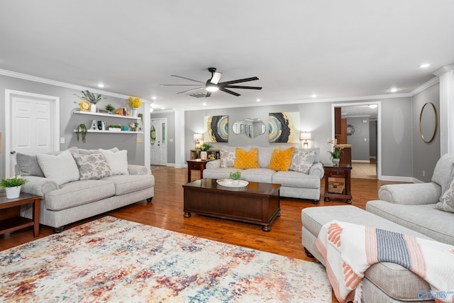 living area with ornamental molding, recessed lighting, ceiling fan, and wood finished floors
