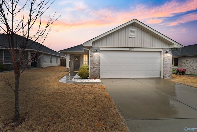 ranch-style house featuring a garage