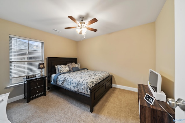 bedroom with light colored carpet and ceiling fan