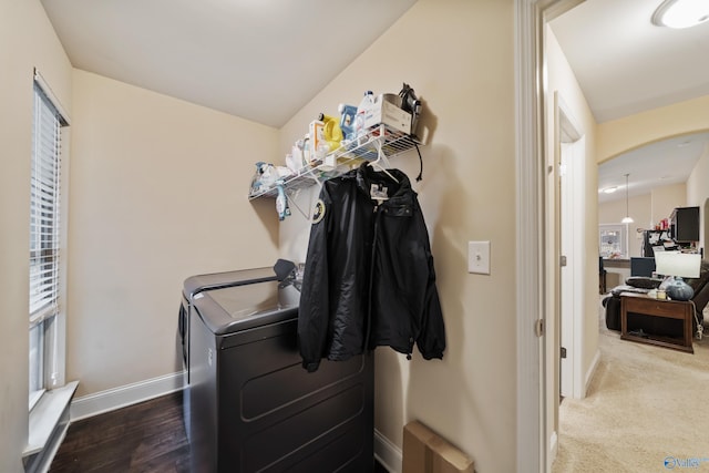 laundry area featuring radiator heating unit and washing machine and clothes dryer