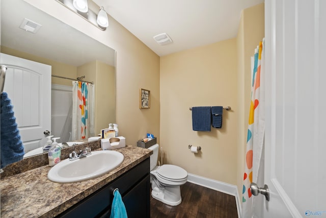 bathroom with a shower with shower curtain, vanity, toilet, and hardwood / wood-style floors