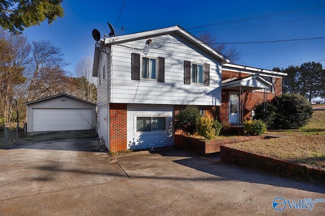 view of front of house with a garage and an outdoor structure