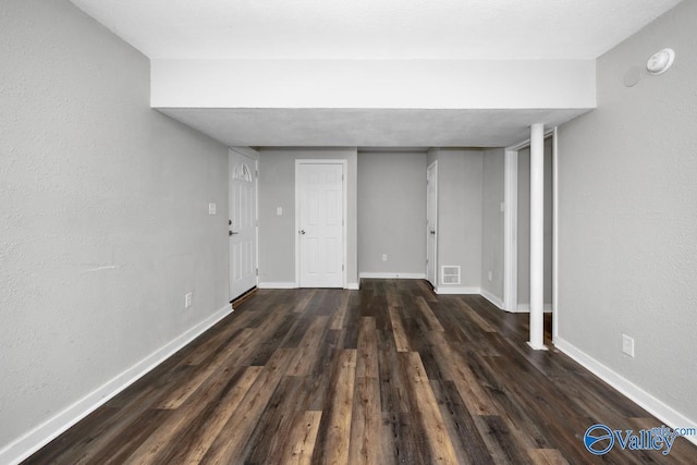 basement featuring dark wood-type flooring