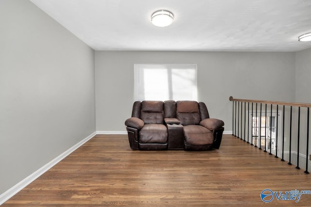 sitting room with wood-type flooring