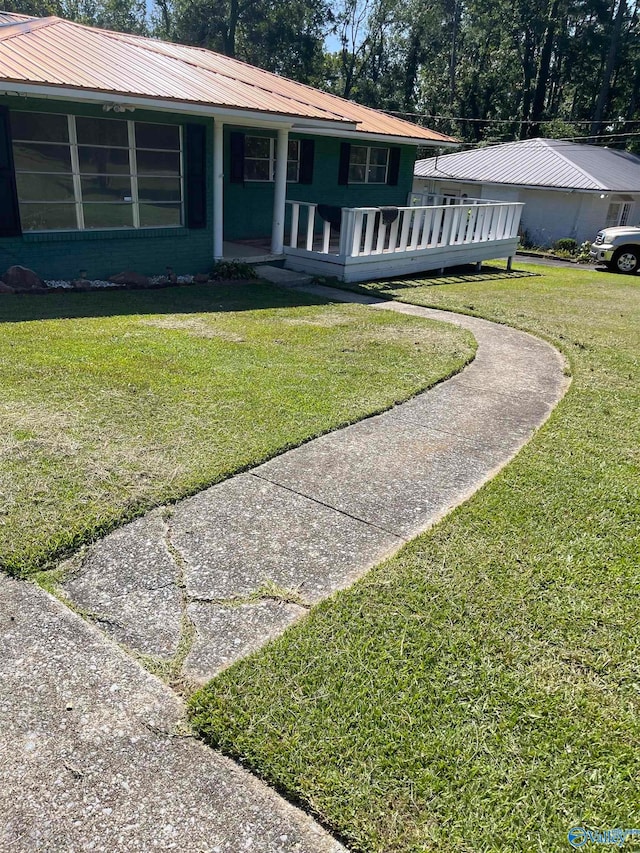 ranch-style home with a front lawn