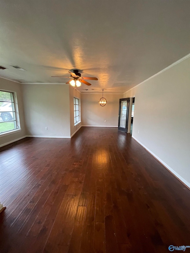 unfurnished living room with dark wood-type flooring, ceiling fan, and a wealth of natural light