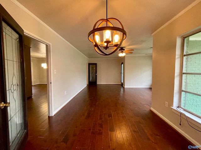 interior space featuring ceiling fan with notable chandelier, plenty of natural light, dark hardwood / wood-style flooring, and ornamental molding