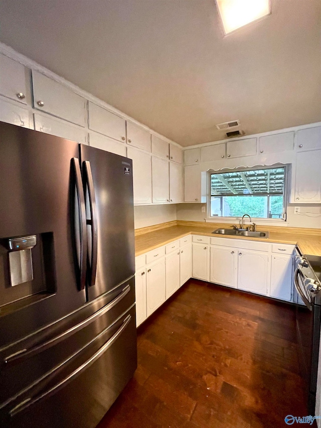 kitchen with stainless steel appliances, sink, dark hardwood / wood-style floors, and white cabinets