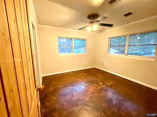 spare room featuring ornamental molding and ceiling fan