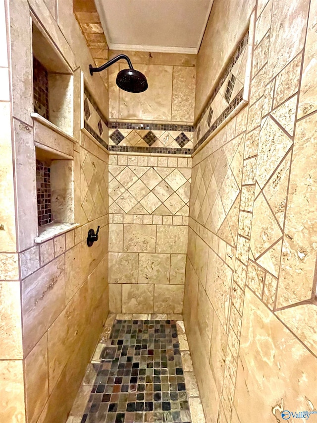 bathroom featuring crown molding and walk in shower