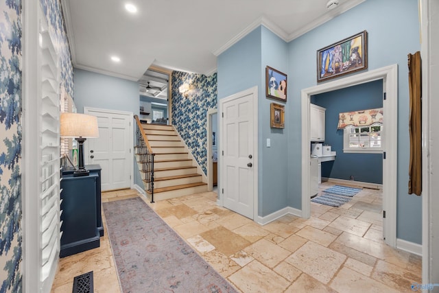 foyer featuring crown molding