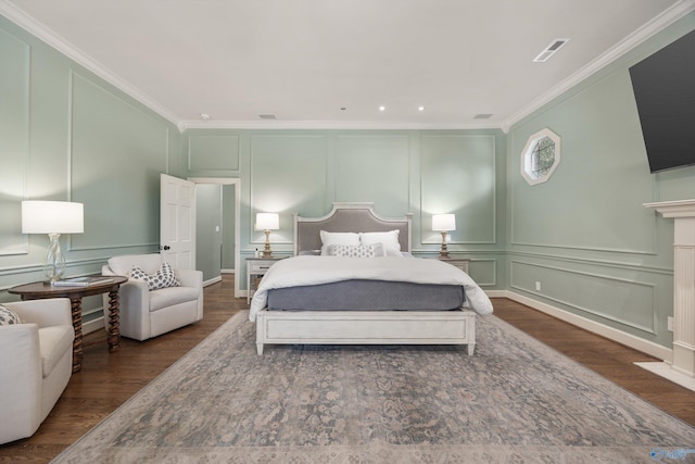 bedroom with dark wood-type flooring and ornamental molding