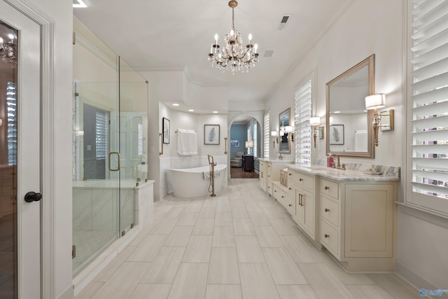 bathroom featuring crown molding, vanity, independent shower and bath, and a notable chandelier